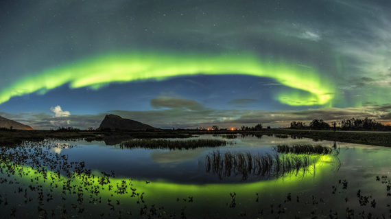 Breathtaking shot of wind of colors reflecting in the sea in Lofoten, Norway
